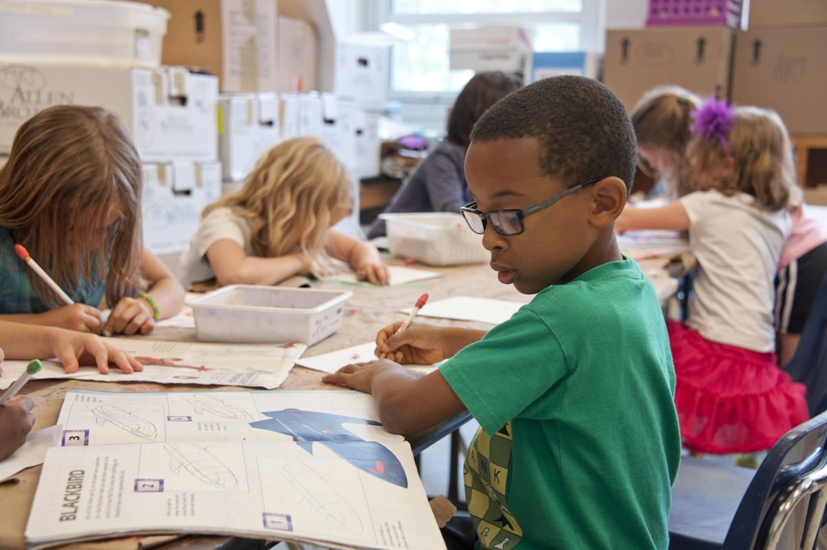 Children learning safely with digital devices in a classroom